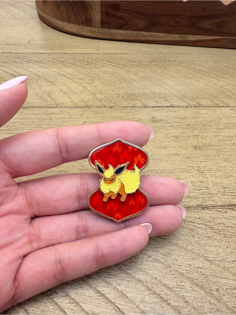 Pokemon Yellow Flareon Enamel Pin on Red Background